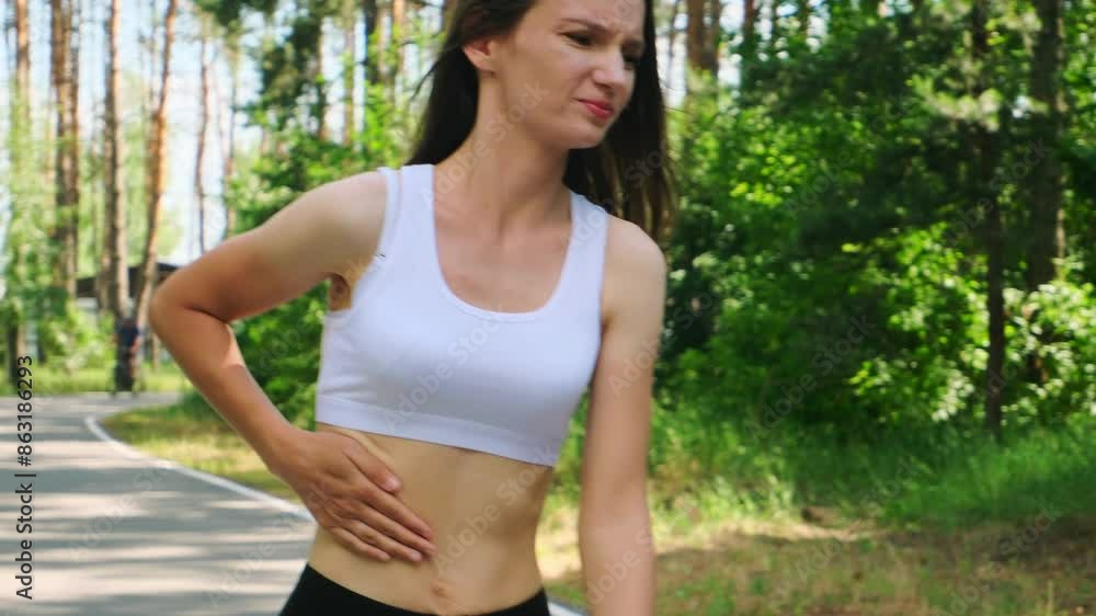 Knee pain woman in a park for fitness, running and exercise while suffering from arthritis. Injured, leg and girl runner training in nature with ache or muscle problem. Knee pain woman in a park for fitness, running and exercise while suffering from arthritis. Injured, leg and girl runner training in nature with ache or muscle problem.