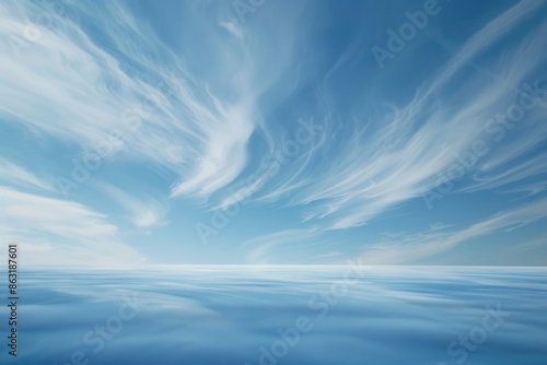 Fototapeta Naklejka Na Ścianę i Meble -  A serene natural scene showing a large body of water with clouds in the sky