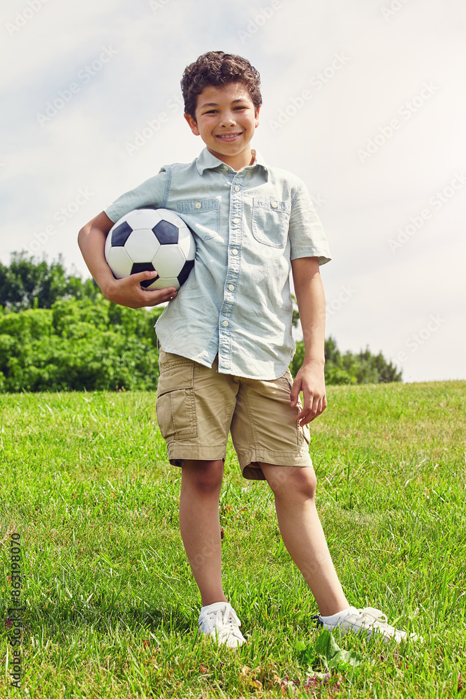 Outdoor, portrait and boy with soccer ball in playground for childhood development, summer or hobby. Nature, sports and Brazilian kid with smile in park for happiness, playing or football game Outdoor, portrait and boy with soccer ball in playground for childhood development, summer or hobby. Nature, sports and Brazilian kid with smile in park for happiness, playing or football game