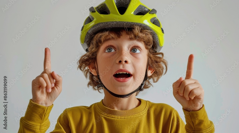 Excited Child Wearing Bicycle Helmet and Pointing Upward Excited Child Wearing Bicycle Helmet and Pointing Upward