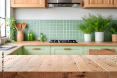 Wooden table on blurred kitchen bench background. Empty wooden table and blurred kitchen background for product mockup