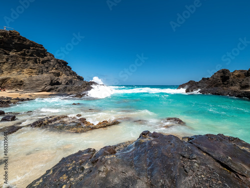 Halona Hawaii Beach Cove and the view to the lava coast with deep blue Pacific Ocean waves