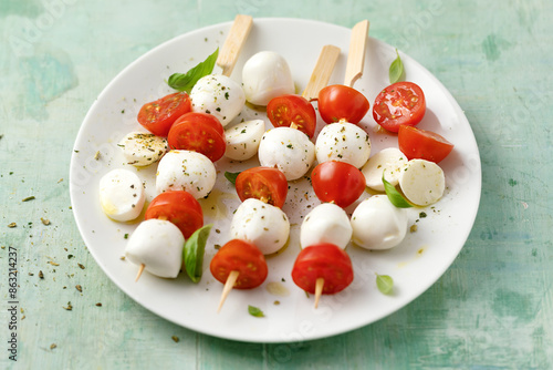 Caprese salad served on plate