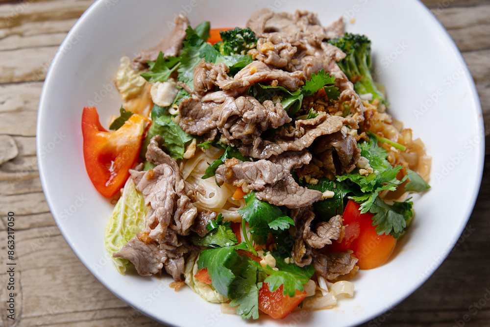 Asian salad with beef and fresh vegetables on plate Asian salad with beef and fresh vegetables on plate