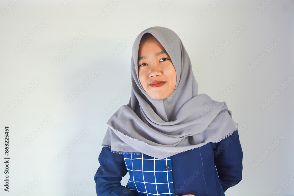 Close-up portrait of herself, attractive cheerful Asian muslim girl showing good choice ok sign advertising solution isolated on bright color background Close-up portrait of herself, attractive cheerful Asian muslim girl showing good choice ok sign advertising solution isolated on bright color background