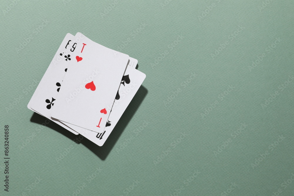 Playing cards on color background, top view. Gambling concept Playing cards on color background, top view. Gambling concept