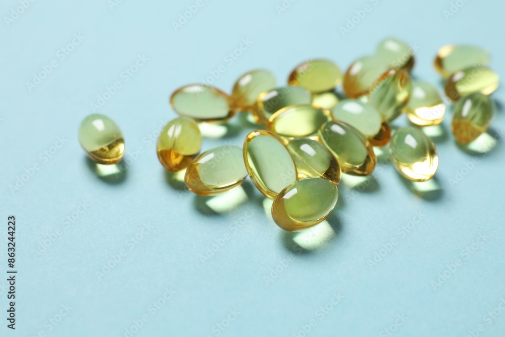 Omega-3 capsules on color background with copyspace. Healthcare, wellbeing and supplements. Omega-3 capsules on color background with copyspace. Healthcare, wellbeing and supplements.