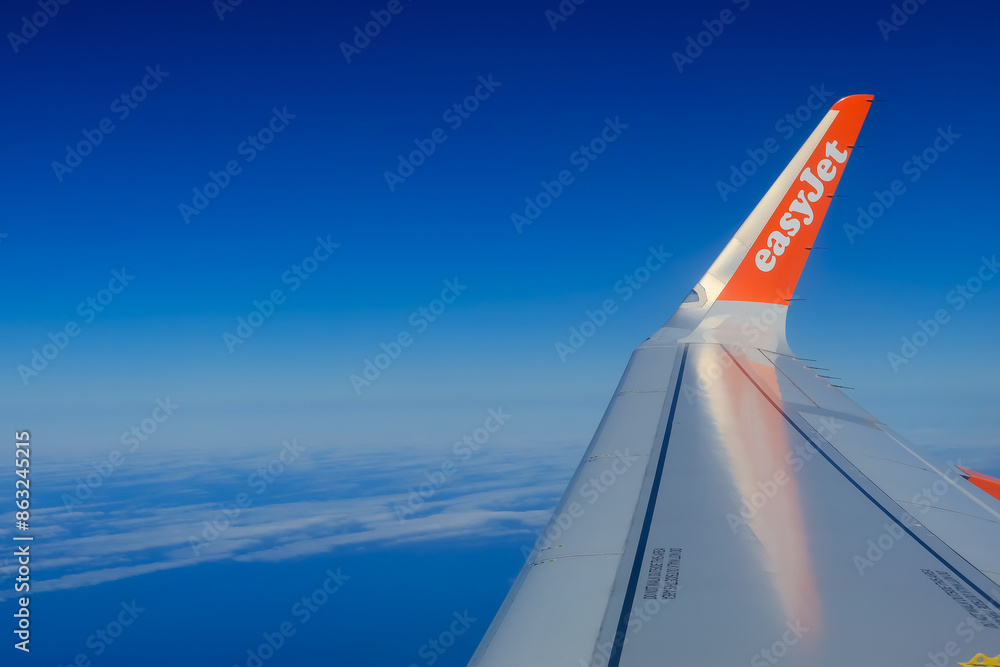 Side view of the tip of the wing on an EasyJet plane during the flight ...