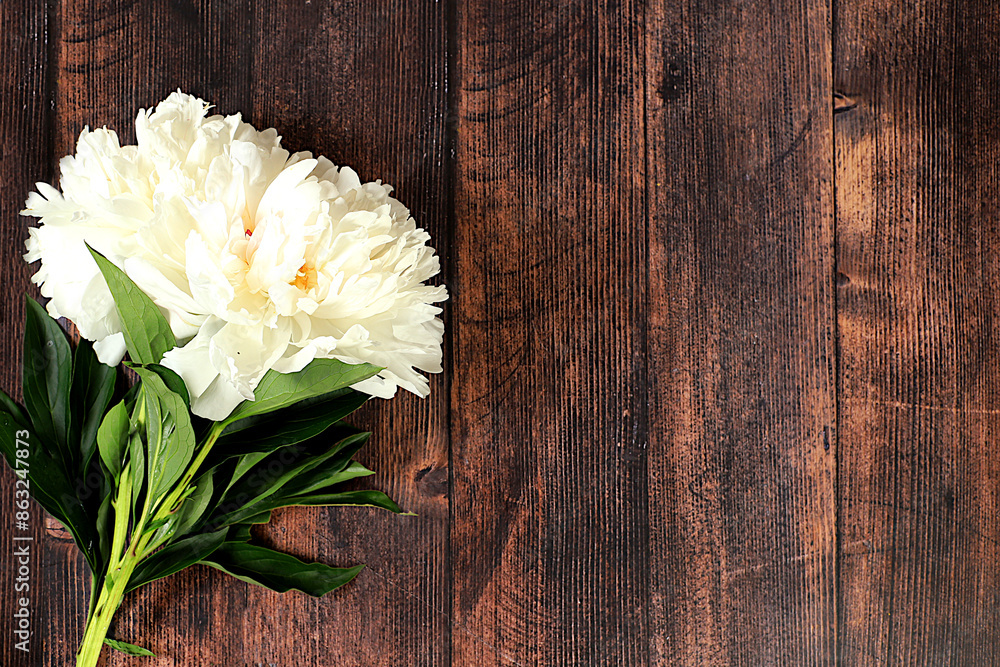 Bouquet of beautiful peonies on an old wooden background,Abstract flower arrangement, flat lay,summer banner with place for text.Creative modern bouquet. Greeting card and holiday concept Bouquet of beautiful peonies on an old wooden background,Abstract flower arrangement, flat lay,summer banner with place for text.Creative modern bouquet. Greeting card and holiday concept