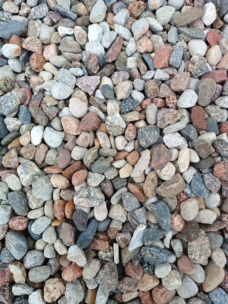 Pebble stones close-up. Decorative texture of stones. Sea stones background. Pebble stones close-up. Decorative texture of stones. Sea stones background.