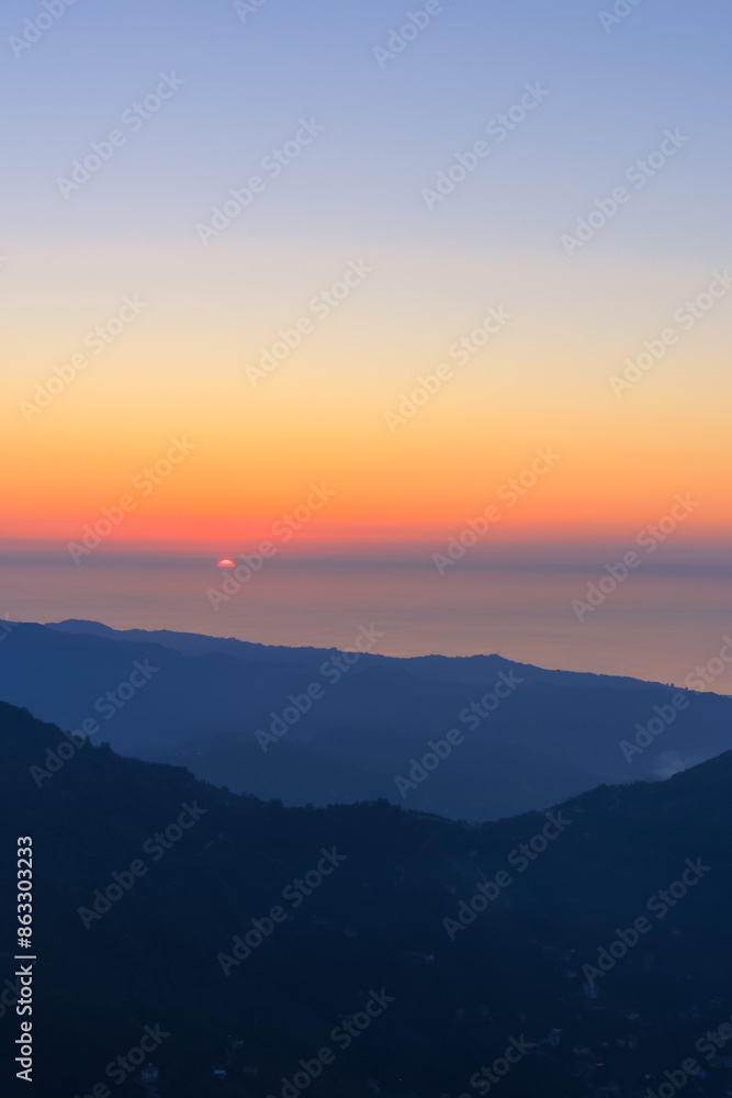 Landscape horizon line in the mountains, orange sunset and blue mountains. Landscape horizon line in the mountains, orange sunset and blue mountains.
