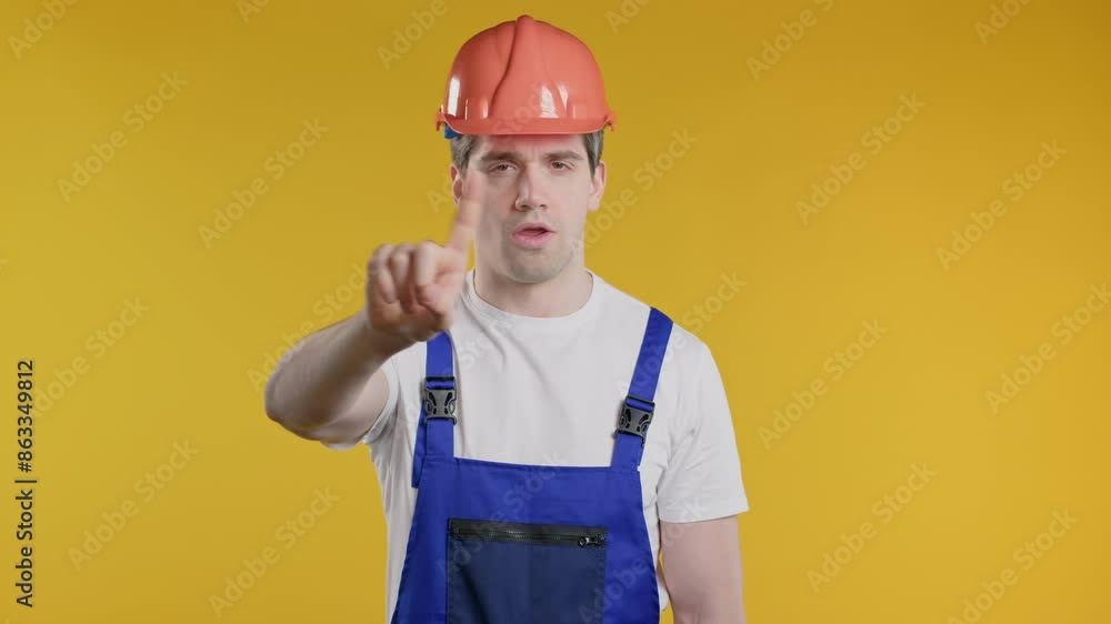 Worker builder man in helmet showing rejecting gesture stop finger sign, enough