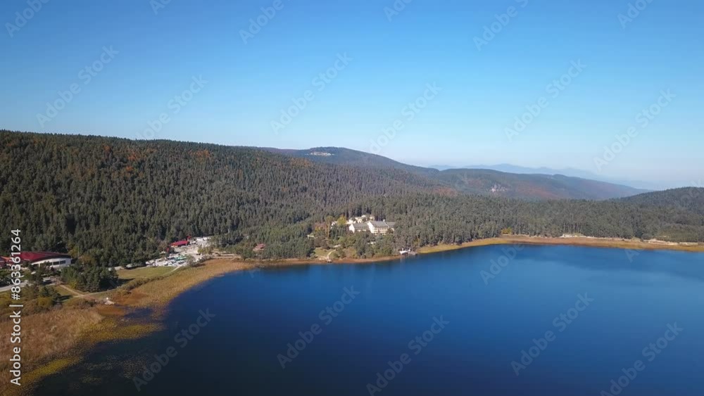 Beautiful autumn landscape with mountains, forest and lake. Abant Golu, Bolu, Aerial View. Drone shot over a beautiful mountain forest lake. Mountain lake with bright cobalt blue water and green trees Beautiful autumn landscape with mountains, forest and lake. Abant Golu, Bolu, Aerial View. Drone shot over a beautiful mountain forest lake. Mountain lake with bright cobalt blue water and green trees