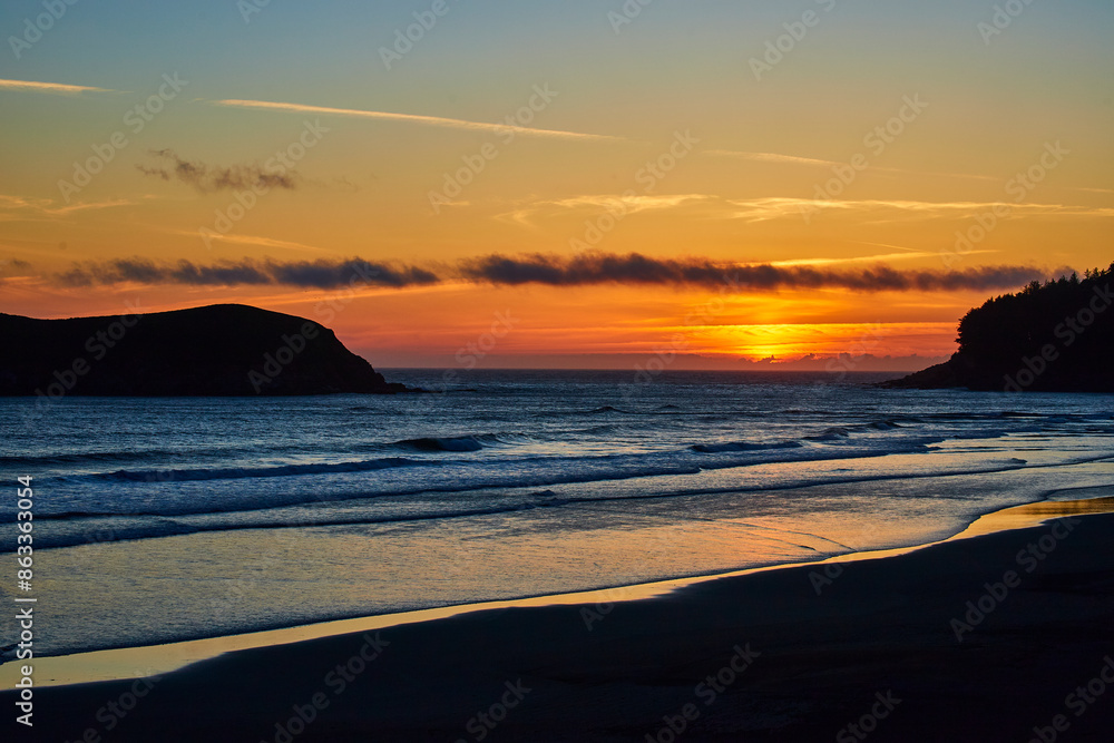 Sunset Over Secluded Oregon Cove from Beach-Level Perspective Sunset Over Secluded Oregon Cove from Beach-Level Perspective