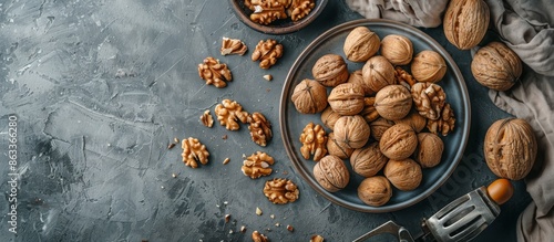 Shelled Walnuts on a Rustic Blue Tabletop With a Nutcracker