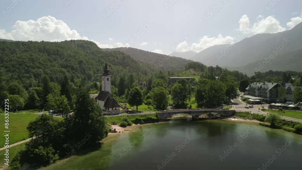Aerial video over Lake Bohinj and Cerkev Sv. Janeza Krstnika in Slovenia Aerial video over Lake Bohinj and Cerkev Sv. Janeza Krstnika in Slovenia