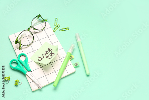 Sticky note with word DONE,...
