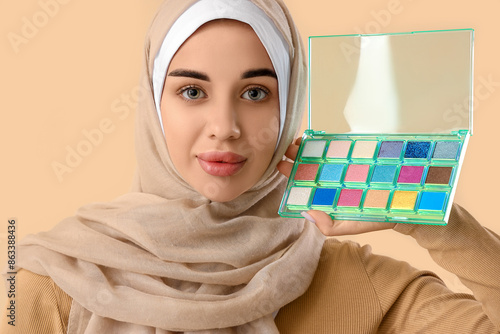 Young Muslim woman with mak...