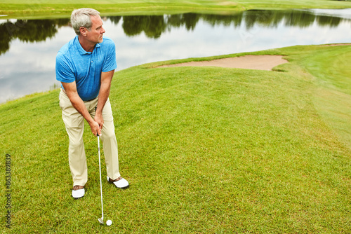 Mature, man and stroke on grass by golf course with club for mental sport, skill and precision or training for tournament. Male golfer, lake and thoughts for game plan, shot strategy and exercise.