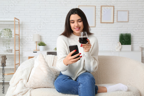 Young woman with glass of w...
