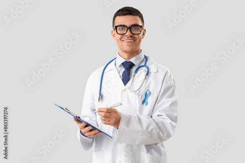 Male urologist with blue ri...