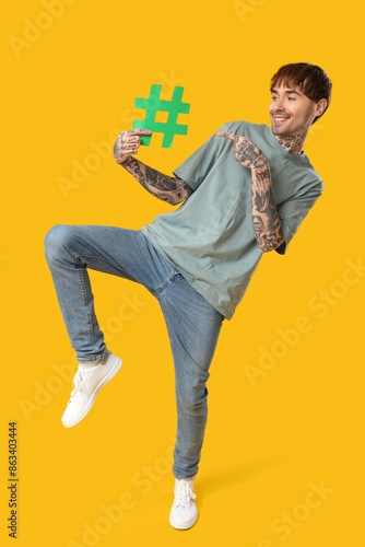 Cool tattooed young man wit...