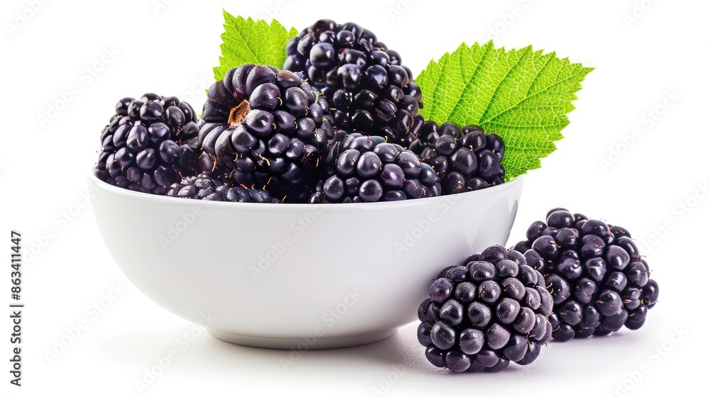 Close up image of a blackberry in a bowl with a leaf isolated on a white background Close up image of a blackberry in a bowl with a leaf isolated on a white background