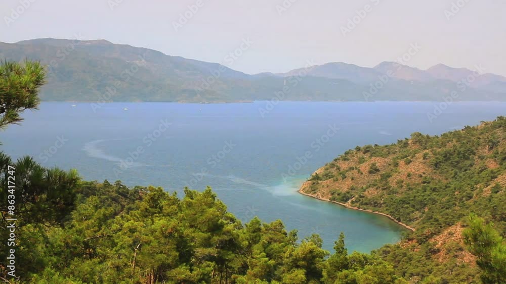 View of Amazon Bay Beach in Marmaris, Turkey. Mediterranean Sea and pine trees in Turkey Country
View of Amazon Bay Beach in Marmaris, Turkey. Mediterranean Sea and pine trees in Turkey Country