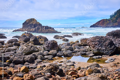 Rugged Oregon Coastline with Tumultuous Sea and Rock Formation at Eye Level