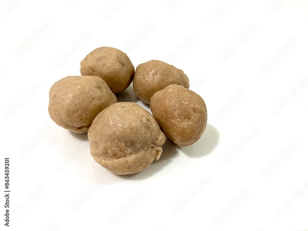 Several whole uncooked Indonesian Bakso Sapi or beef meatballs isolated on white background Several whole uncooked Indonesian Bakso Sapi or beef meatballs isolated on white background