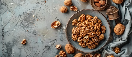 Shelled Walnuts on a Rustic Blue Tabletop With a Nutcracker