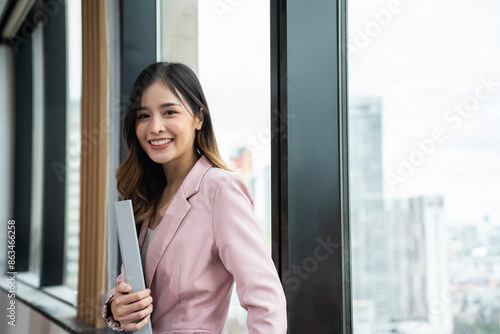 Portrait of Asian beautiful business woman smile while work in office. Free Download Portrait of Asian beautiful business woman smile while work in office. - GFXLoad