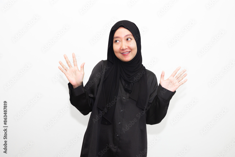 Beautiful and cheerful young Asian Muslim woman, with various expressions. isolated on white background Beautiful and cheerful young Asian Muslim woman, with various expressions. isolated on white background