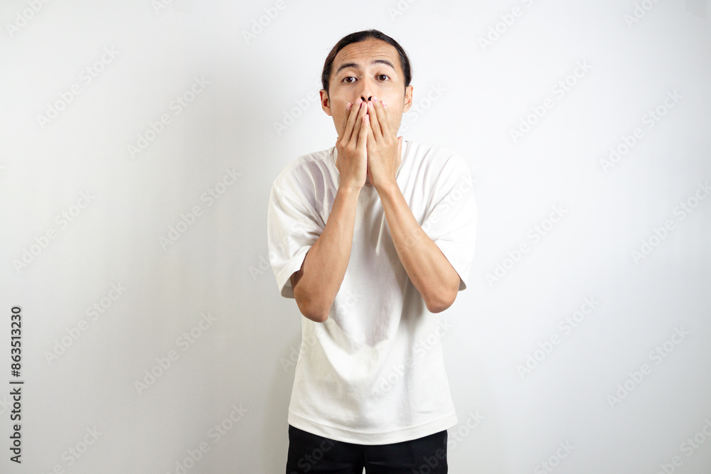 Young asian man with surprised facial expression. isolated on white. Young asian man with surprised facial expression. isolated on white.