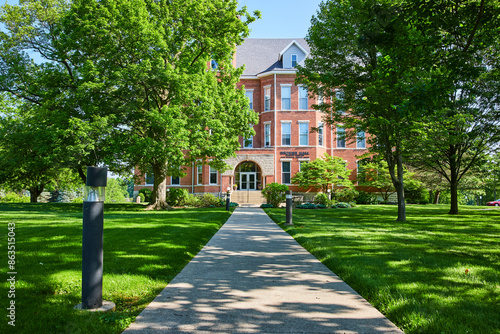 Traditional Huntington Campus Building Amidst Greenery Eye-Level Pathway View