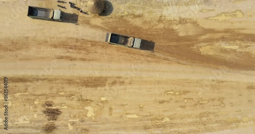 Dirt truck load full of dirt, Deliver to fill wasted land nearby City, Over a green fields Cover the water.