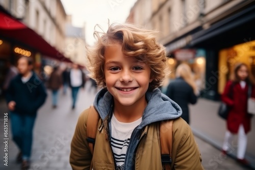 Wallpaper Mural Portrait of a cute little boy with blond curly hair in the city Torontodigital.ca