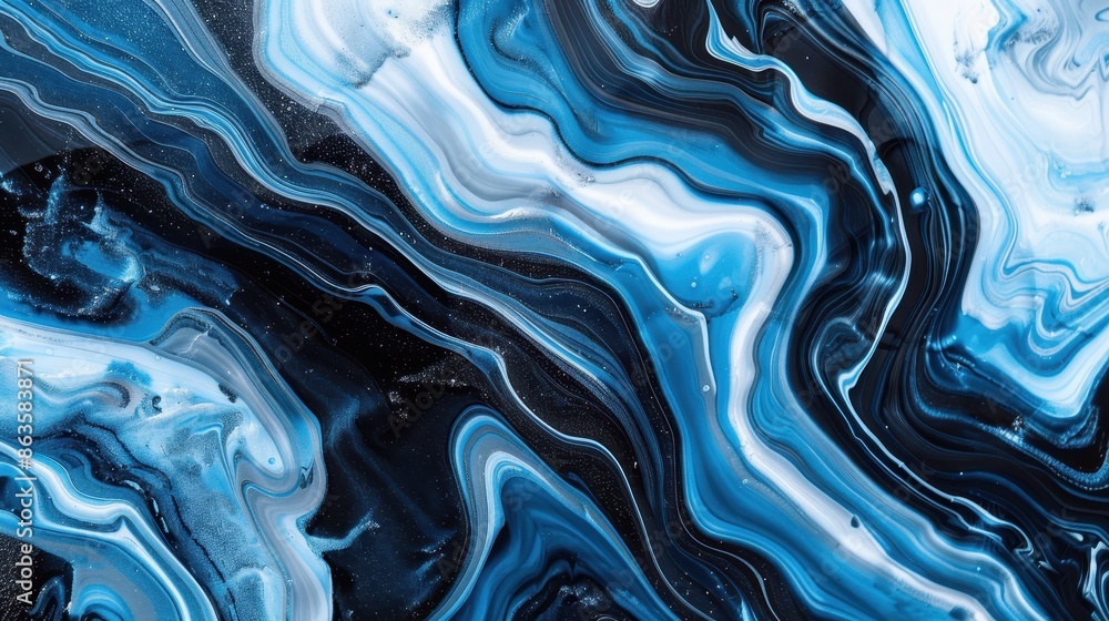 Obraz premium A blue and white swirl pattern with a lot of dots. The blue and white color scheme gives the impression of a calm and peaceful ocean. The dots in the pattern add a sense of movement and energy