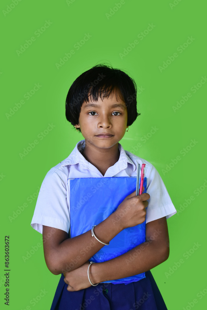 Portrait of a school girl wearing uniform holds note books in hand Portrait of a school girl wearing uniform holds note books in hand