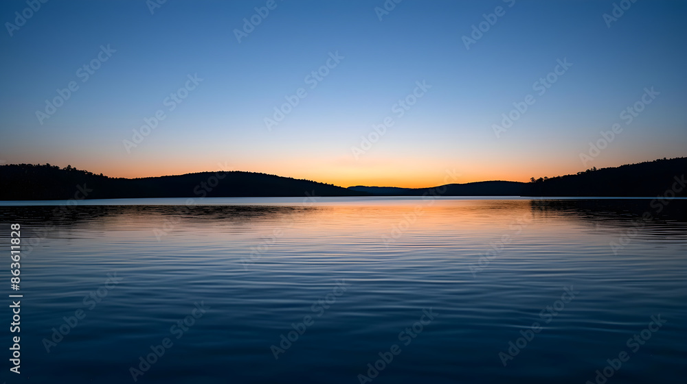 A peaceful sunset reflecting on the still waters of a tranquil lake, capturing nature's beauty. A peaceful sunset reflecting on the still waters of a tranquil lake, capturing nature's beauty.