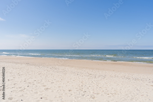 Fototapeta Naklejka Na Ścianę i Meble -  Baltic sea. Sand, sky, sea water and waves. The Baltic sea in the Kurshskaya Kosa in the Kaliningrad region. 