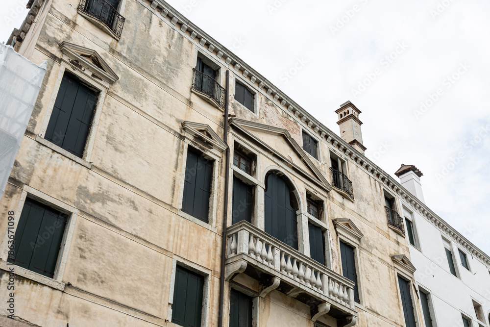 Fototapeta premium View to typical house in Venice with windows with shutters