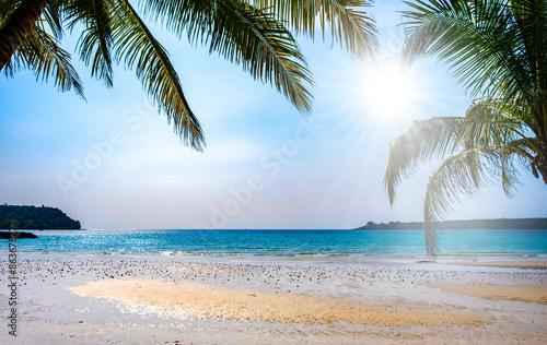  beach sand background for summer vacation concept. Beach nature and summer seawater with sunlight light sandy beach Sparkling sea water photo