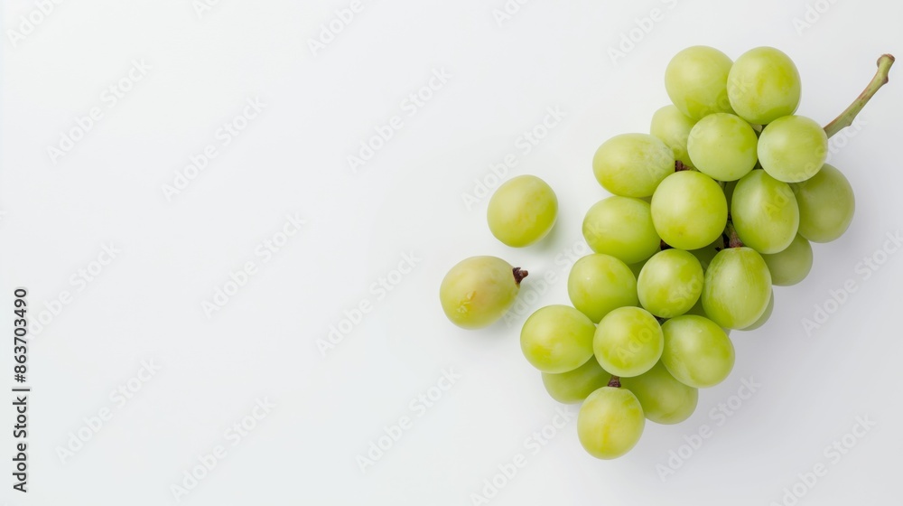Green grapes on white background, top view Green grapes on white background, top view
