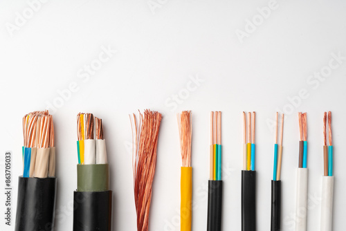 Obraz na płótnie Various Electrical Wires With Exposed Copper Strands on White Background