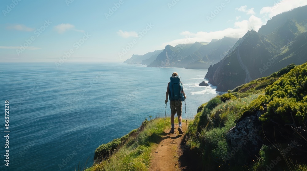 Fototapeta premium Backpacker trekking through a picturesque coastal path, capturing dramatic ocean views, scenic travel adventure