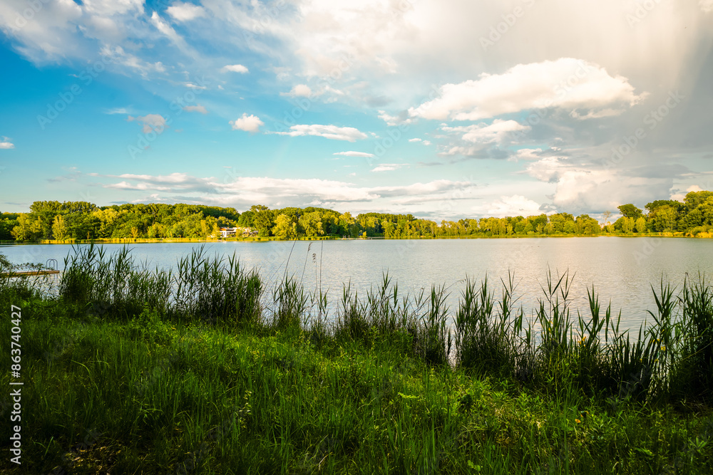 View of the quarry pond near Ingolstadt with the surrounding nature. Landscape by the lake in the recreation area.
View of the quarry pond near Ingolstadt with the surrounding nature. Landscape by the lake in the recreation area.