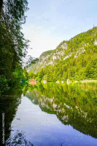 View of the Berglsteiner Lake with the surrounding green nature. Idyllic mountain lake in the Alpbachtal in Tyrol near Kufstein. Landscape in Austria.
 photo