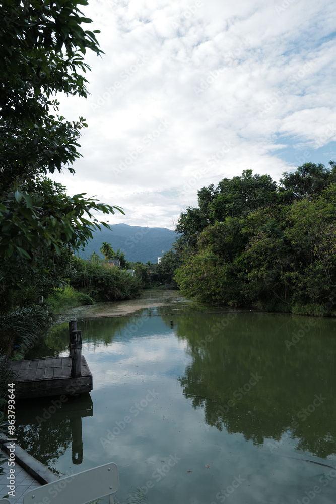 Natural landscape of lake view with green mountain park Natural landscape of lake view with green mountain park