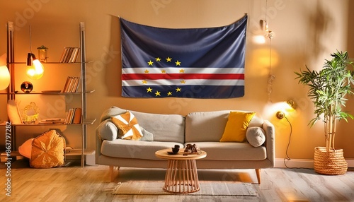 The flag of Cabo Verde hangs in the living room at home. The flag is in house. photo